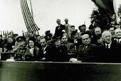 The national funeral in Terezin September 16, 1945. On the grand stand M. Horáková and J. Masaryk (sitting second from the right)