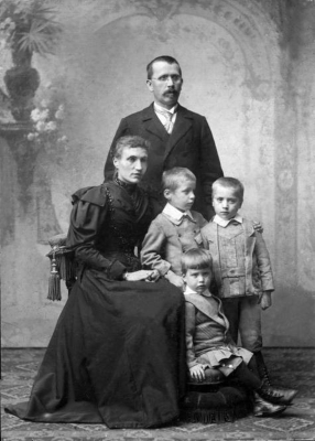 With his parents, Joseph and Mary, and with his siblings,
around 1896